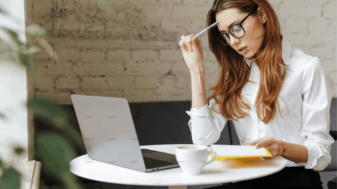 demo-attachment-2051-thoughtful-business-woman-indoors-using-laptop-P5HYUQX@2x-1-min-238